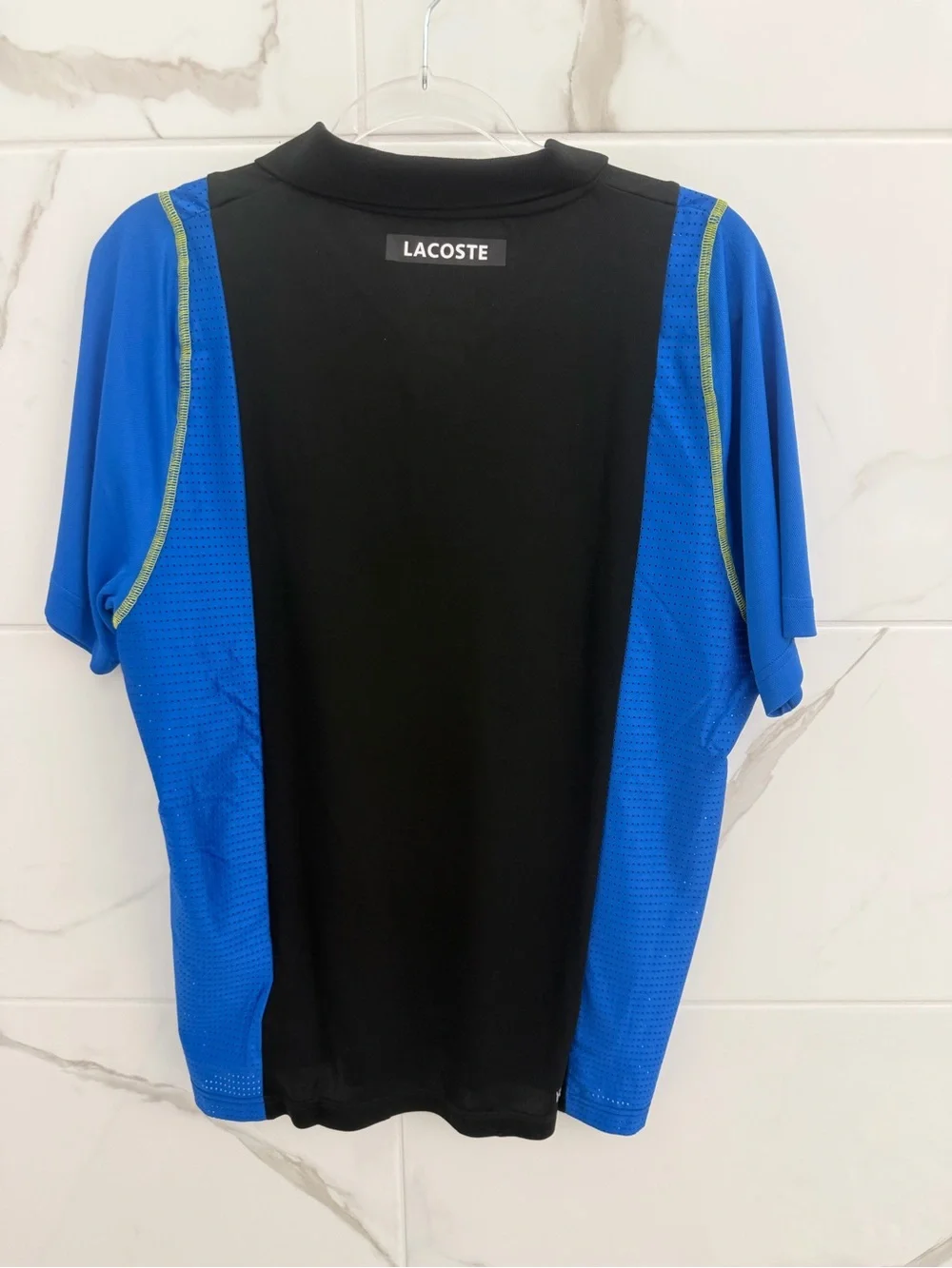 Lacoste Black Polo with Blue Panels and Green Accents